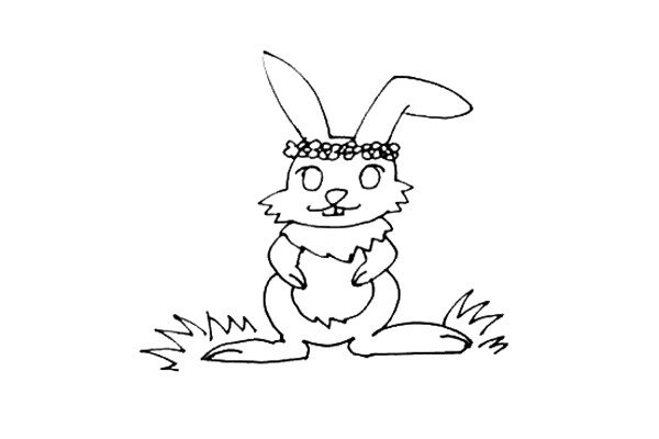 第七步：给小兔子画上一个漂亮的花环，旁边再画上一些小草是不是更漂亮了。