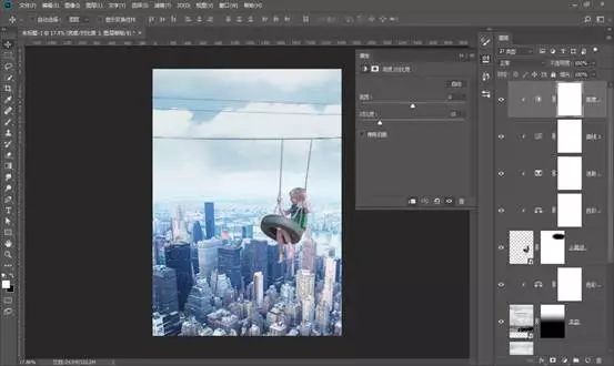場景合成，通過PS合成在城市上空蕩秋千的男孩